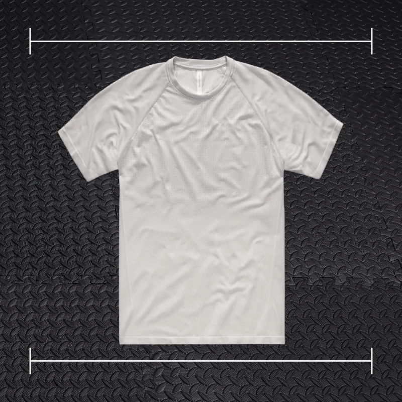 a grey ten thousand shirt laid over top a photo of black rubber gym flooring
