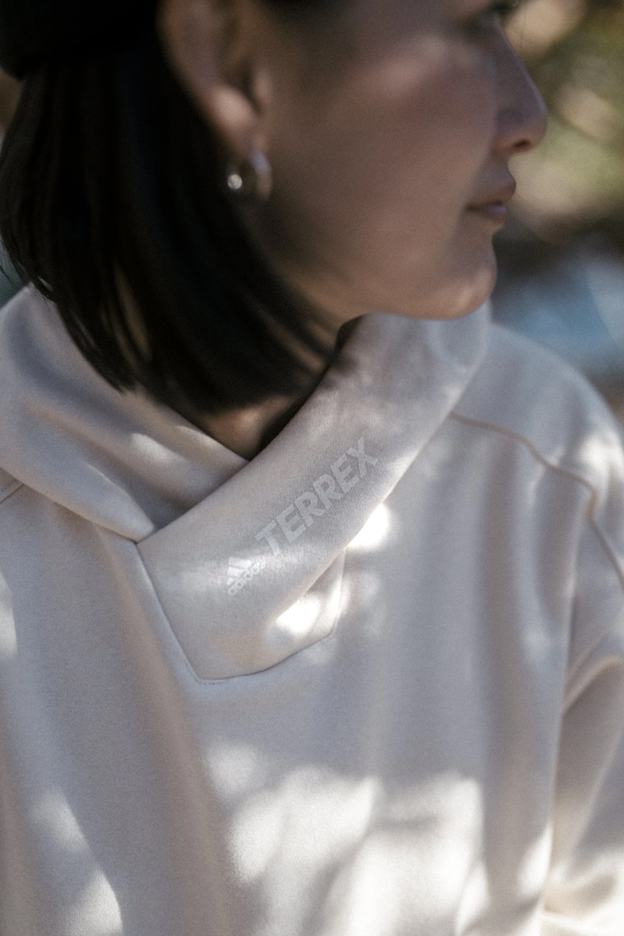 woman wearing an adidas hoodie