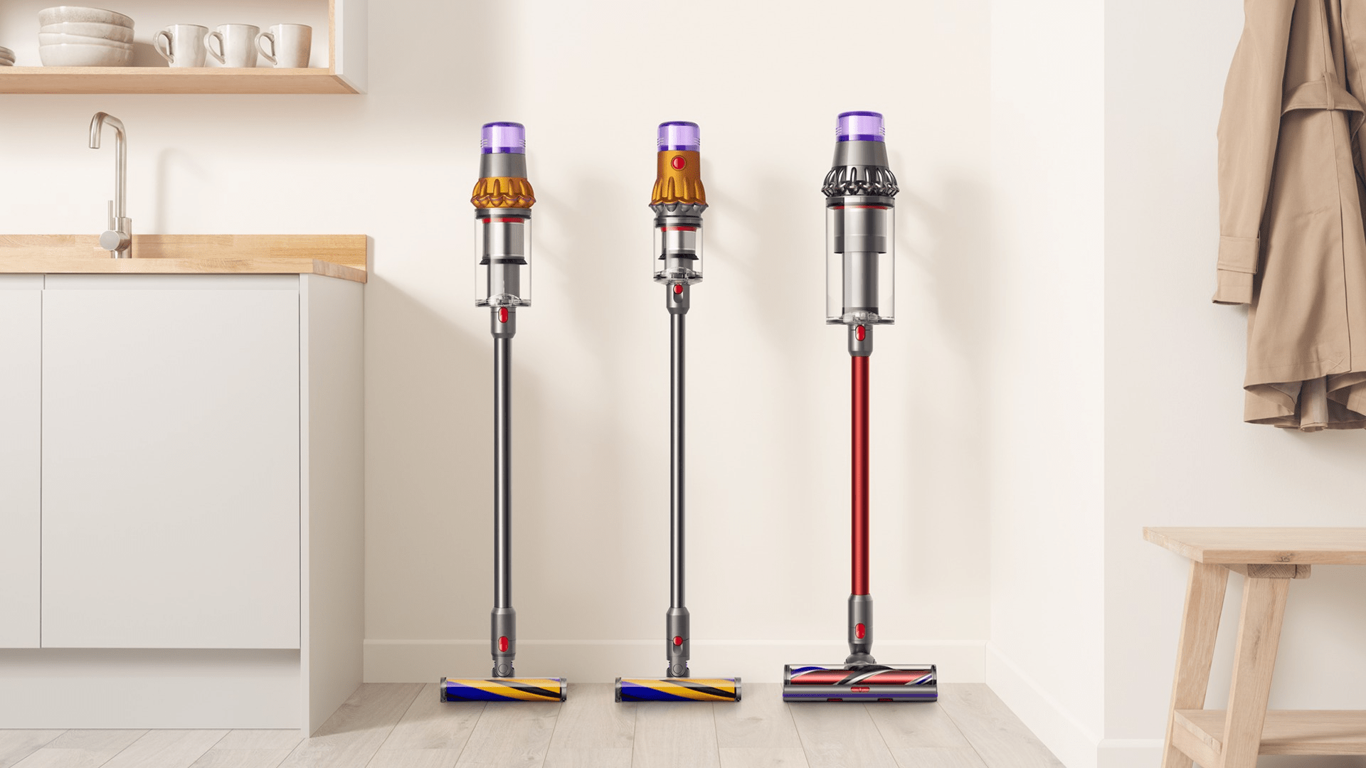 dyson stick vacuums in a clean kitchen nook