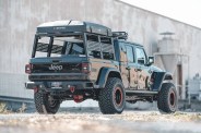 a jeep truck with a truck bed rack