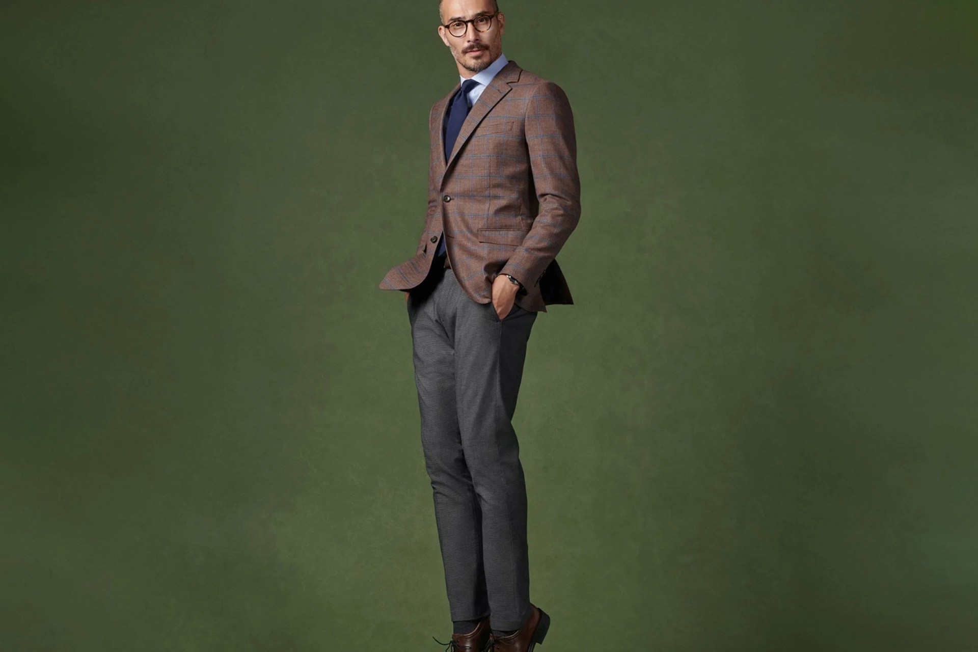 a man wearing a suit while jumping