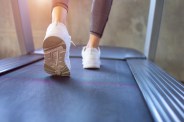 close up on shoe man running in a gym on a treadmill