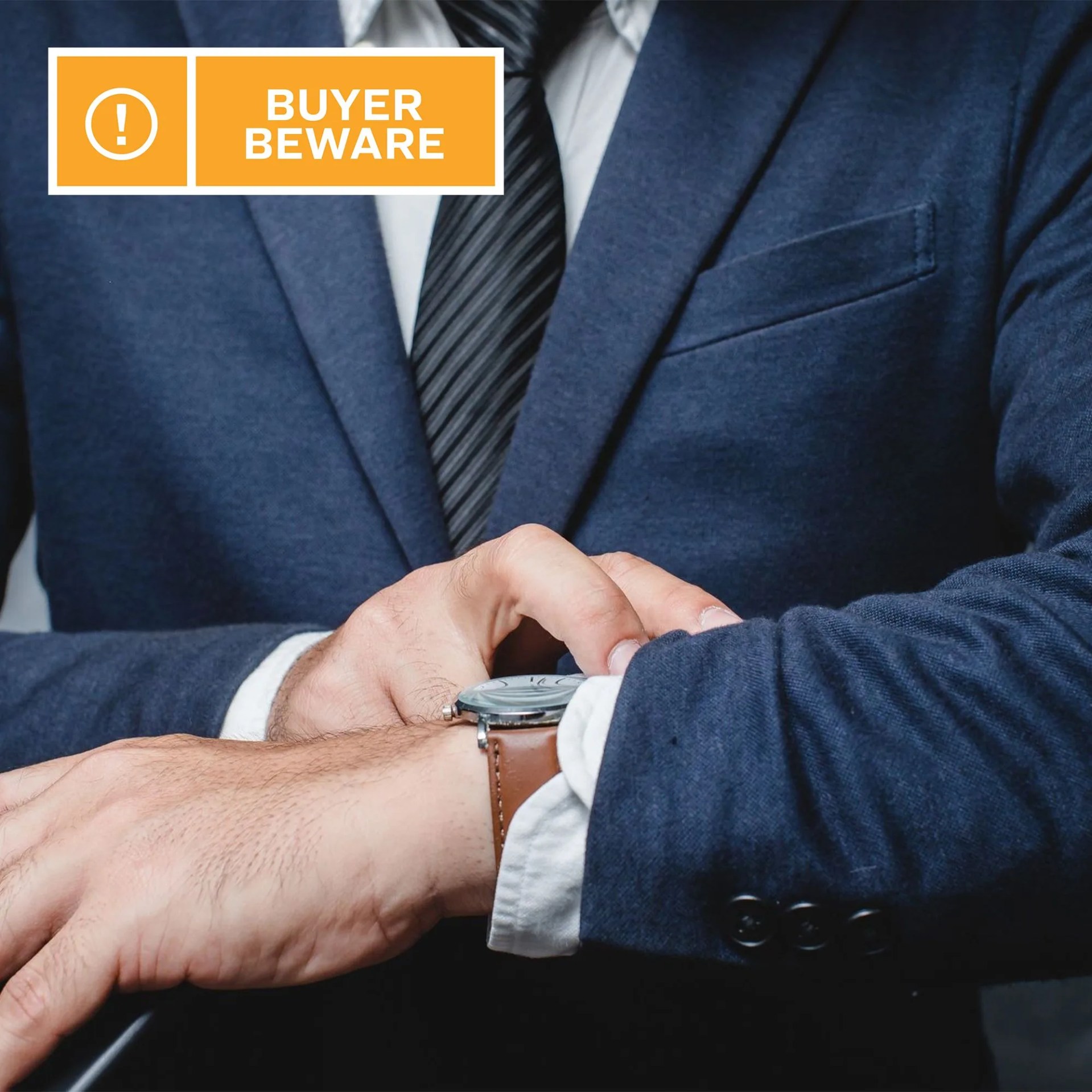 man looking at a watch on his wrist