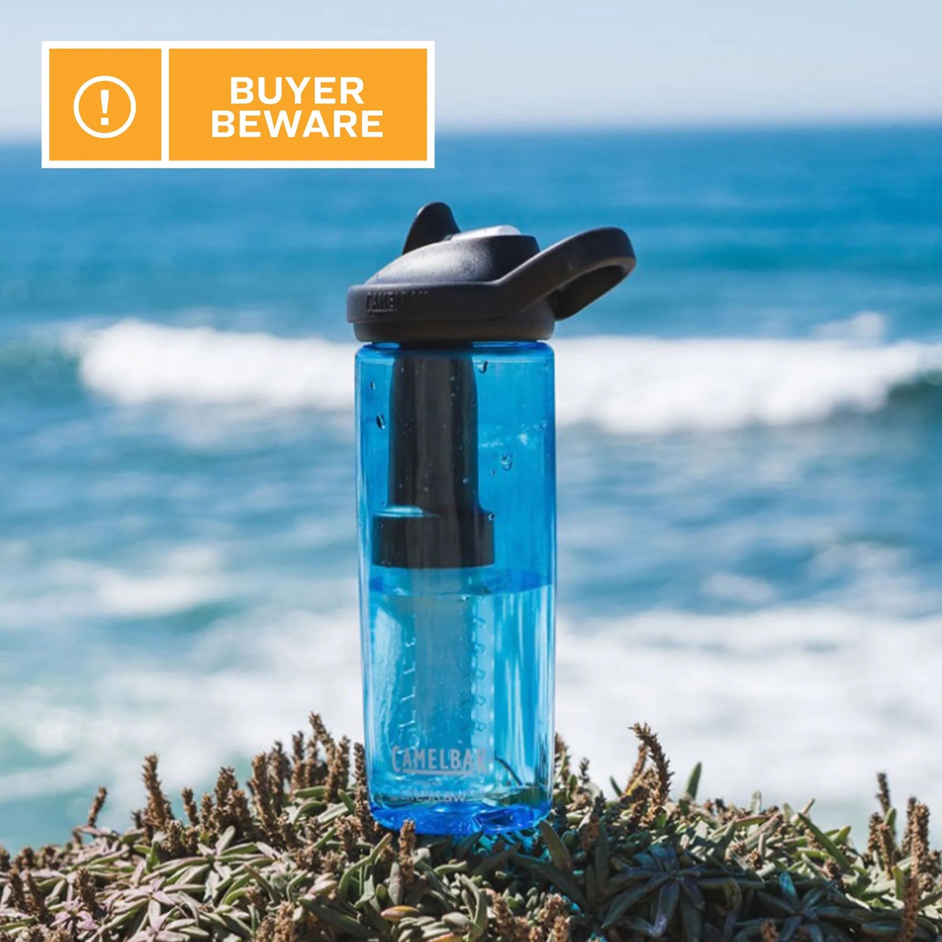 camelbak plastic water bottle with an ocean in the background