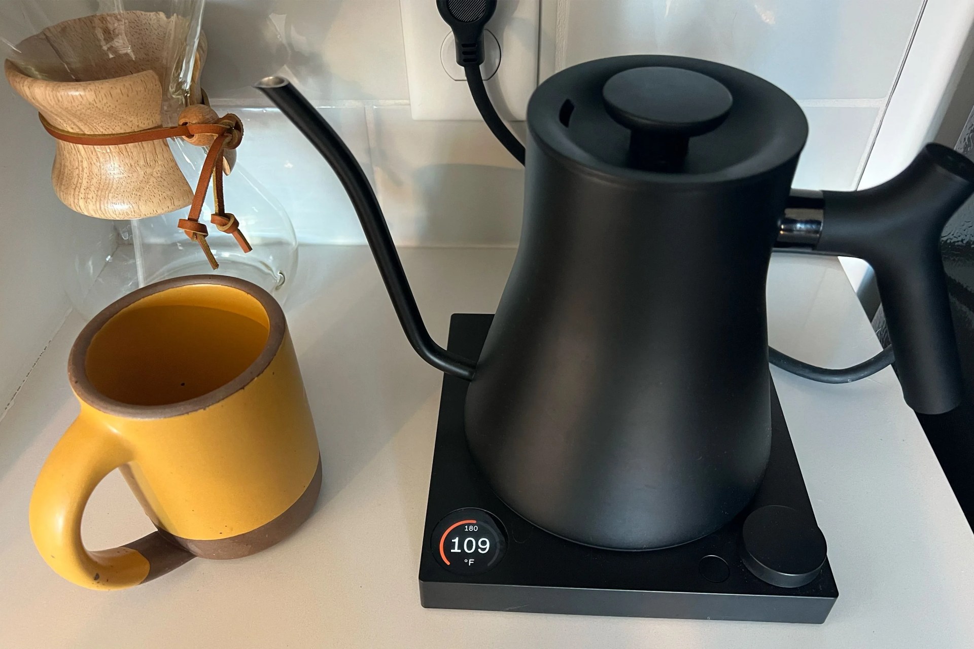 stagg ekg pro kettle on a counter next to a mug