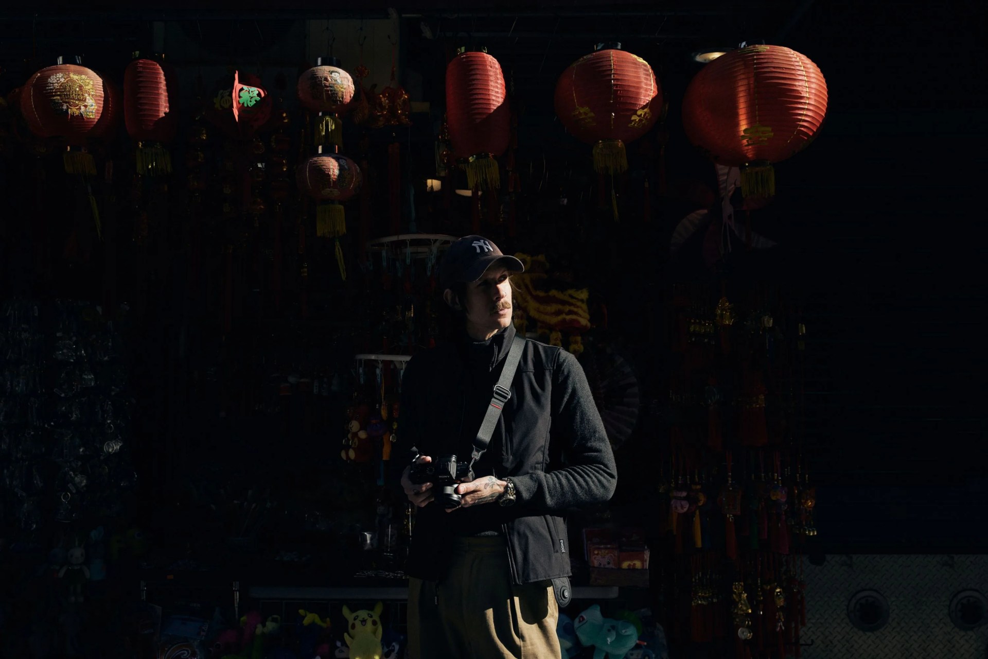 ewool eric marin with chinese red lanterns behind him