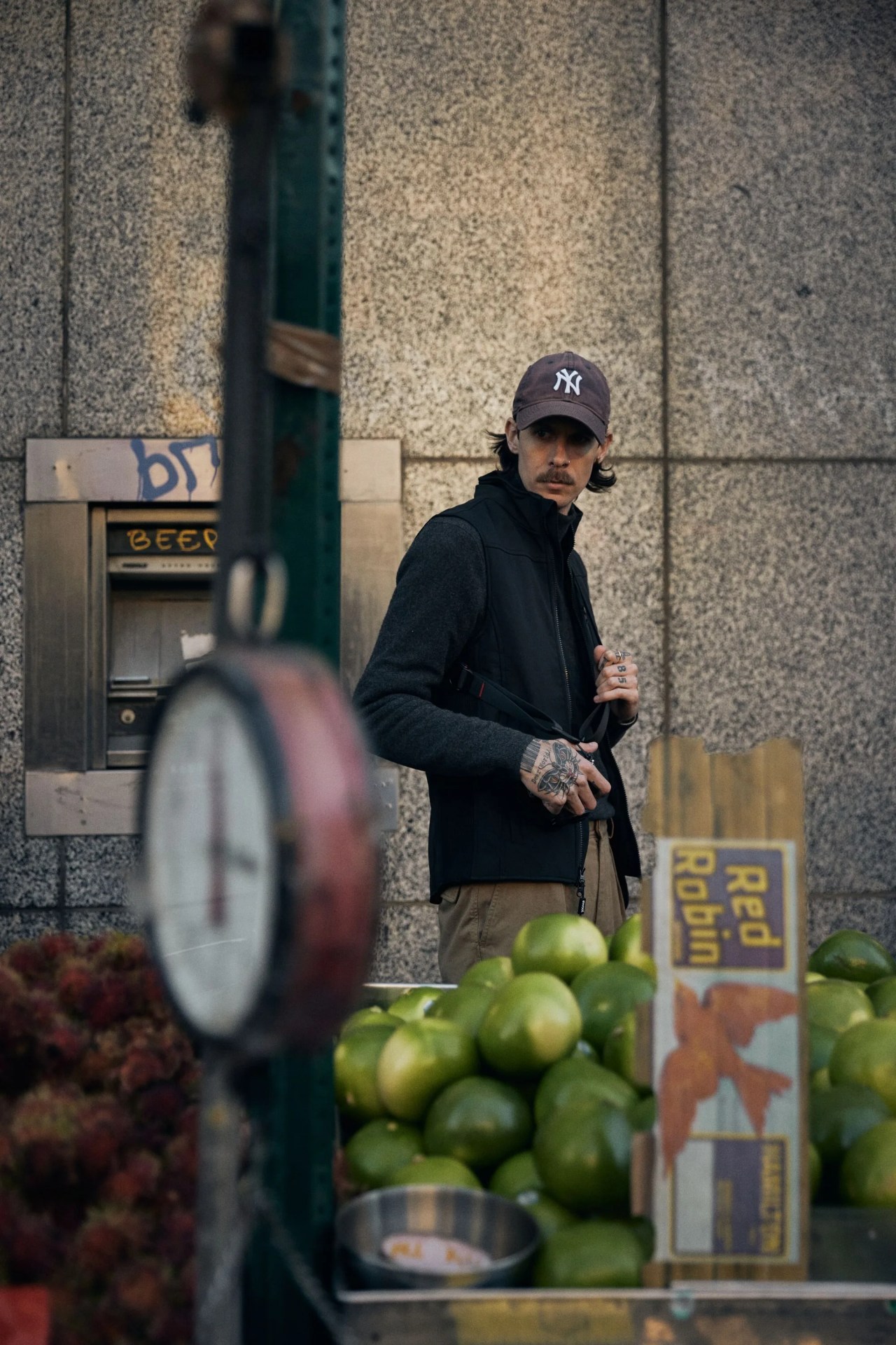 ewool eric marin looking at some fruit on the street