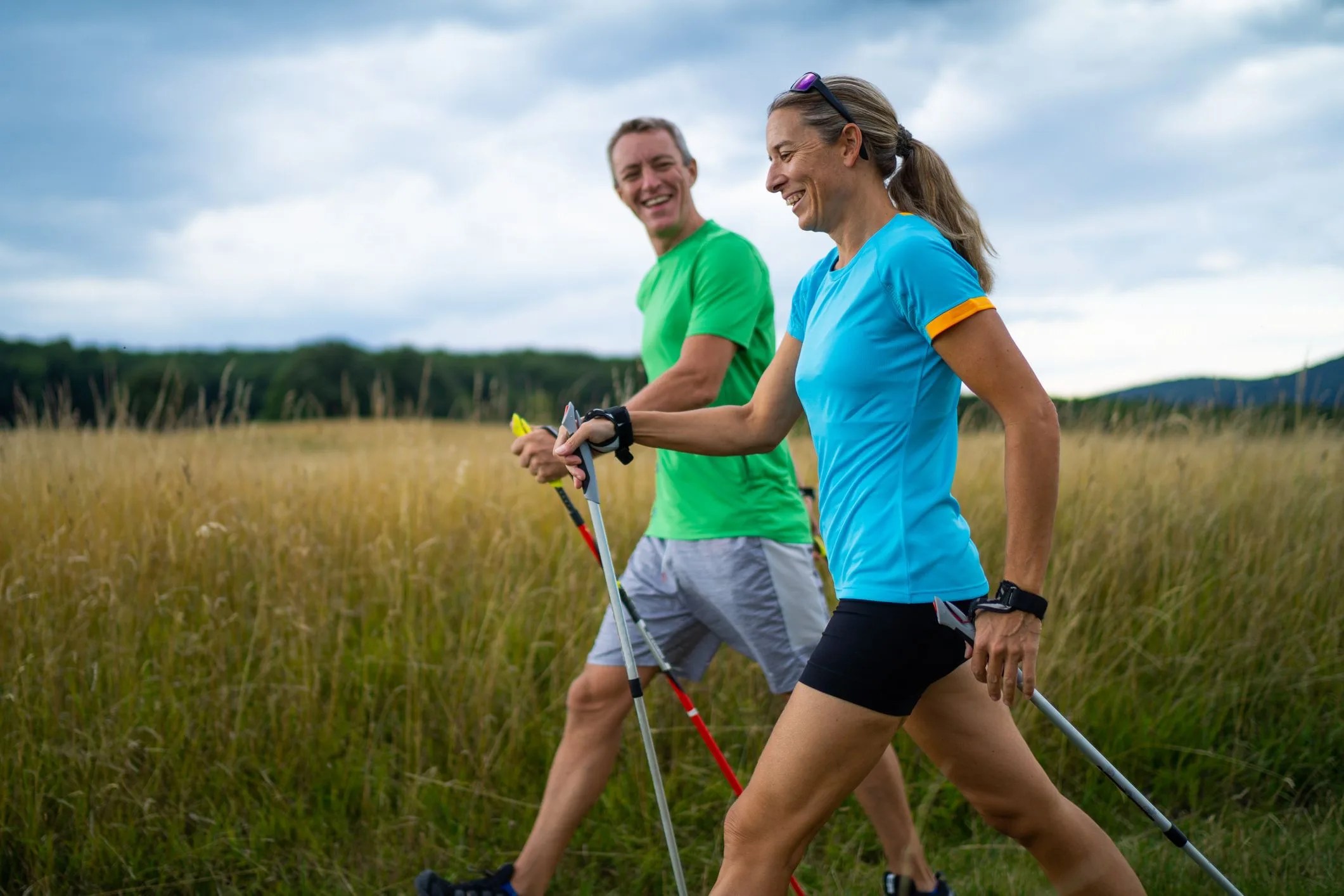 happy adult nordic walkers