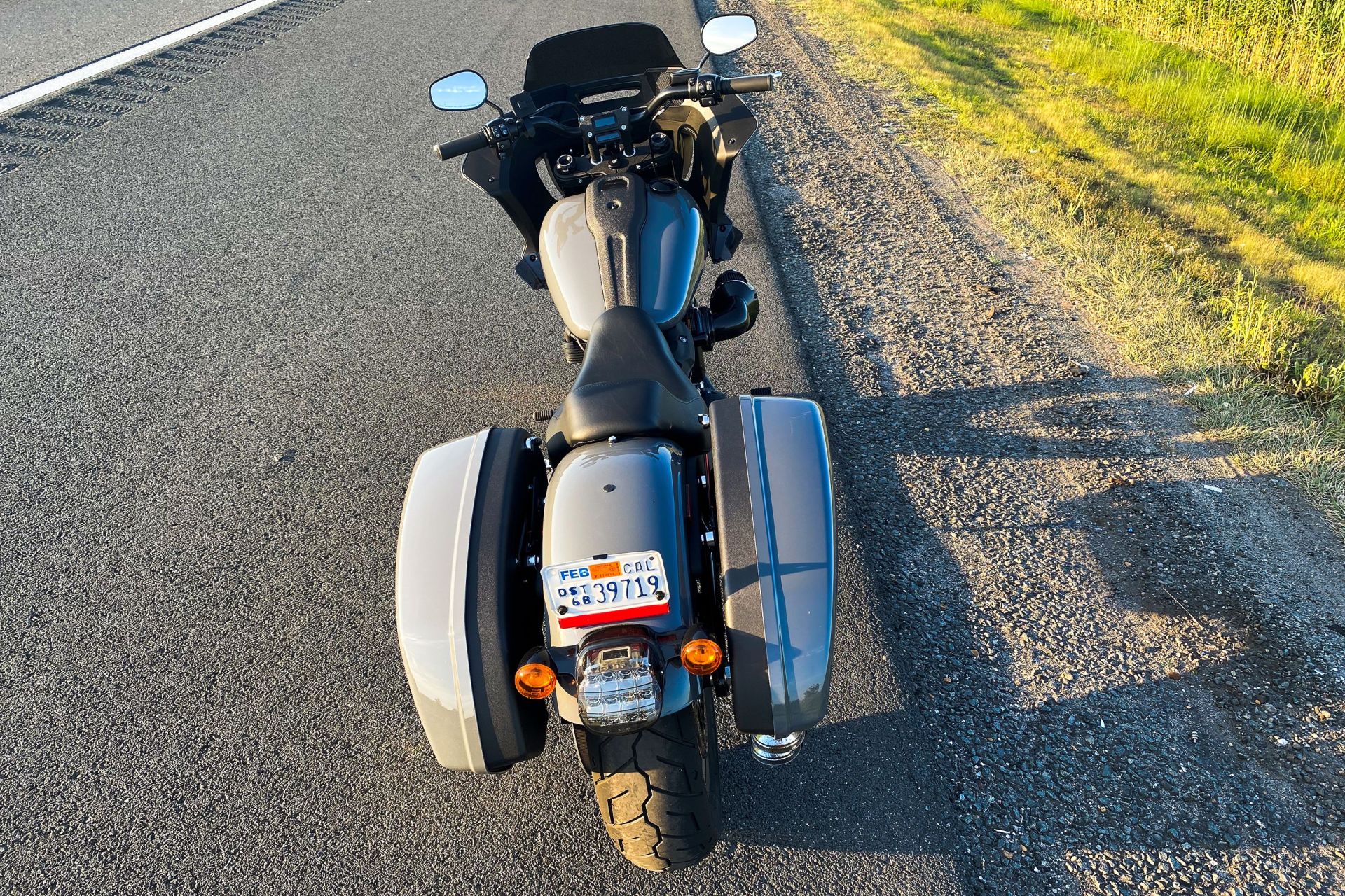 harley low rider st motorcycle parked on side of road
