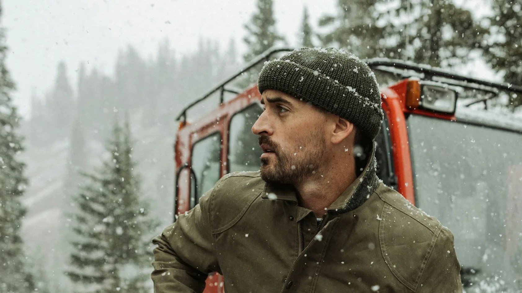man wearing beanie in snow