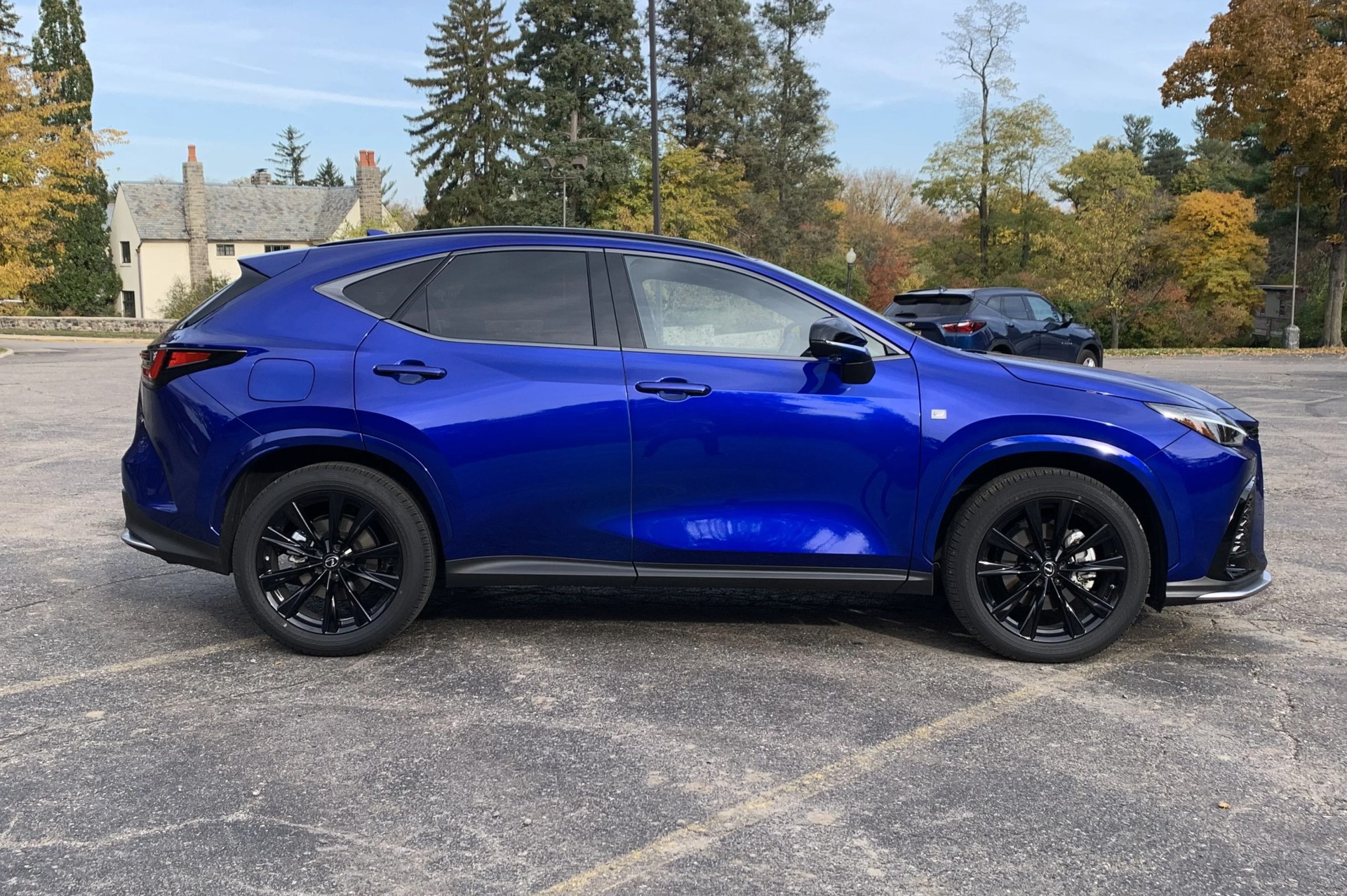 lexus nx viewed from the side in a parking lot