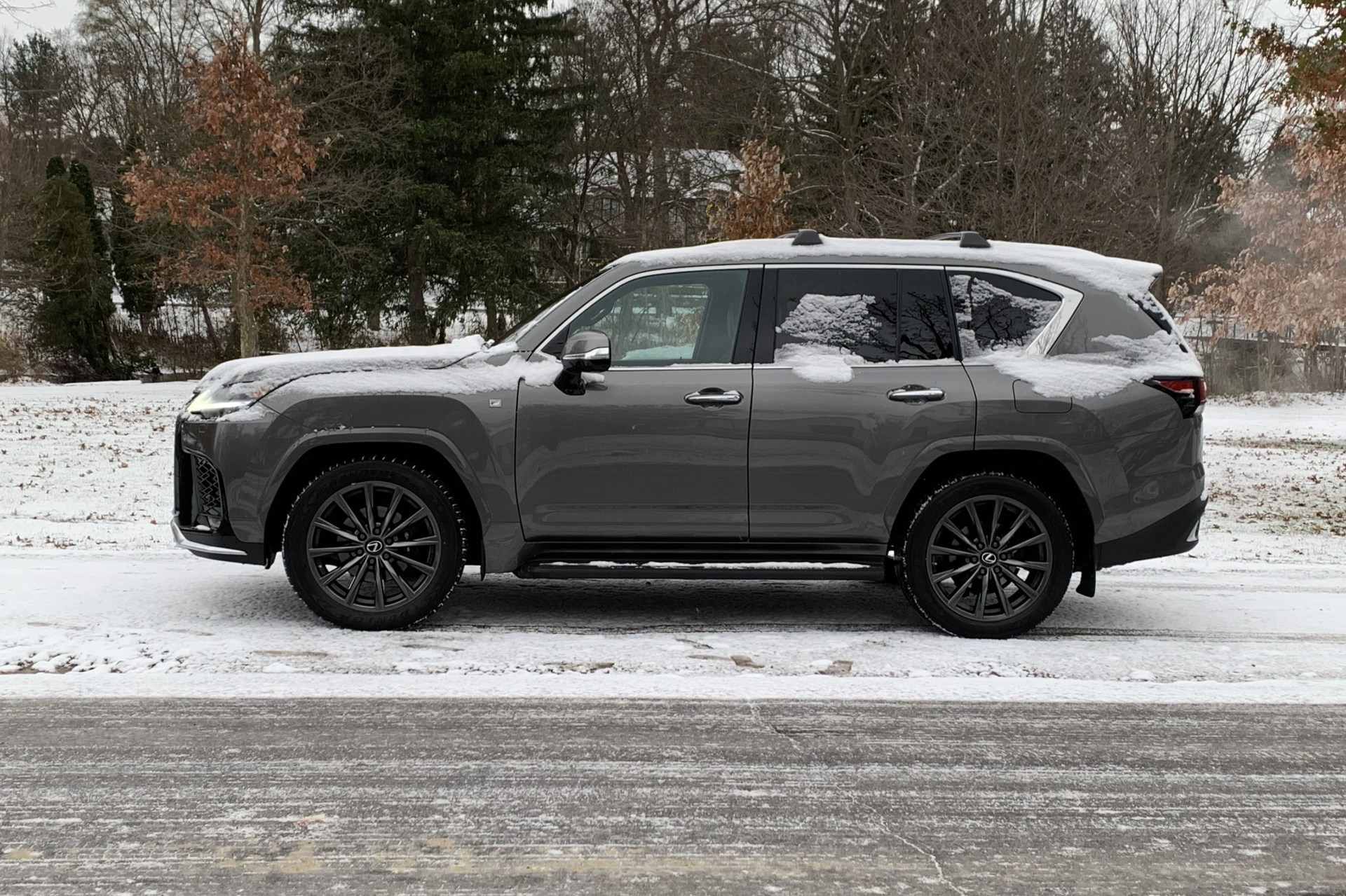 lexus lx 600 parked on the side of a snowy road
