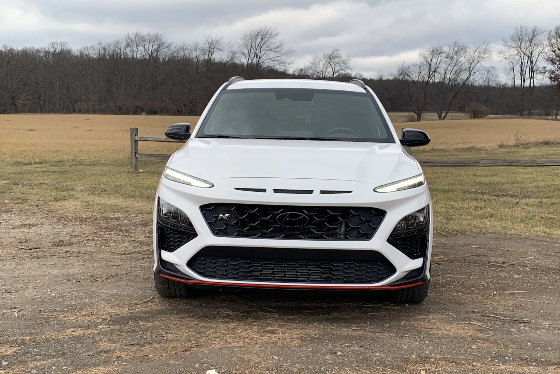 hyundai kona n parked near a field
