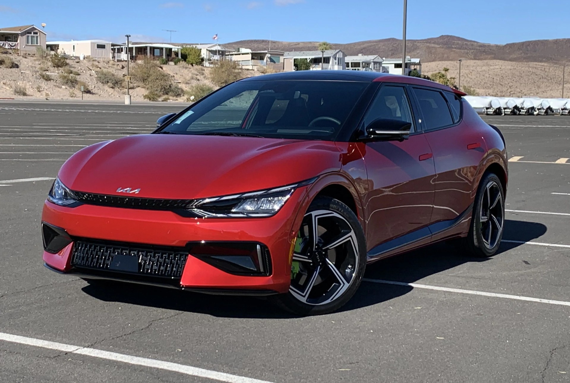 kia ev6 gt in a parking lot with nevada desert in background