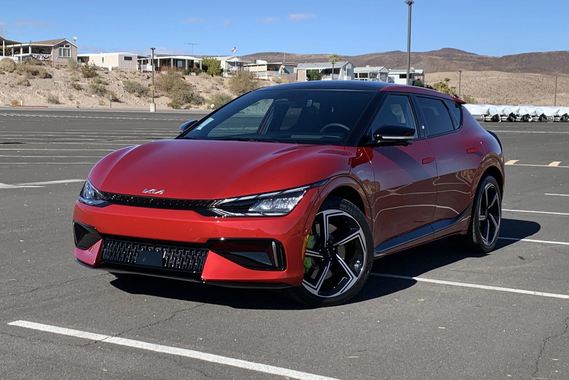 kia ev6 gt in a parking lot with nevada desert in background