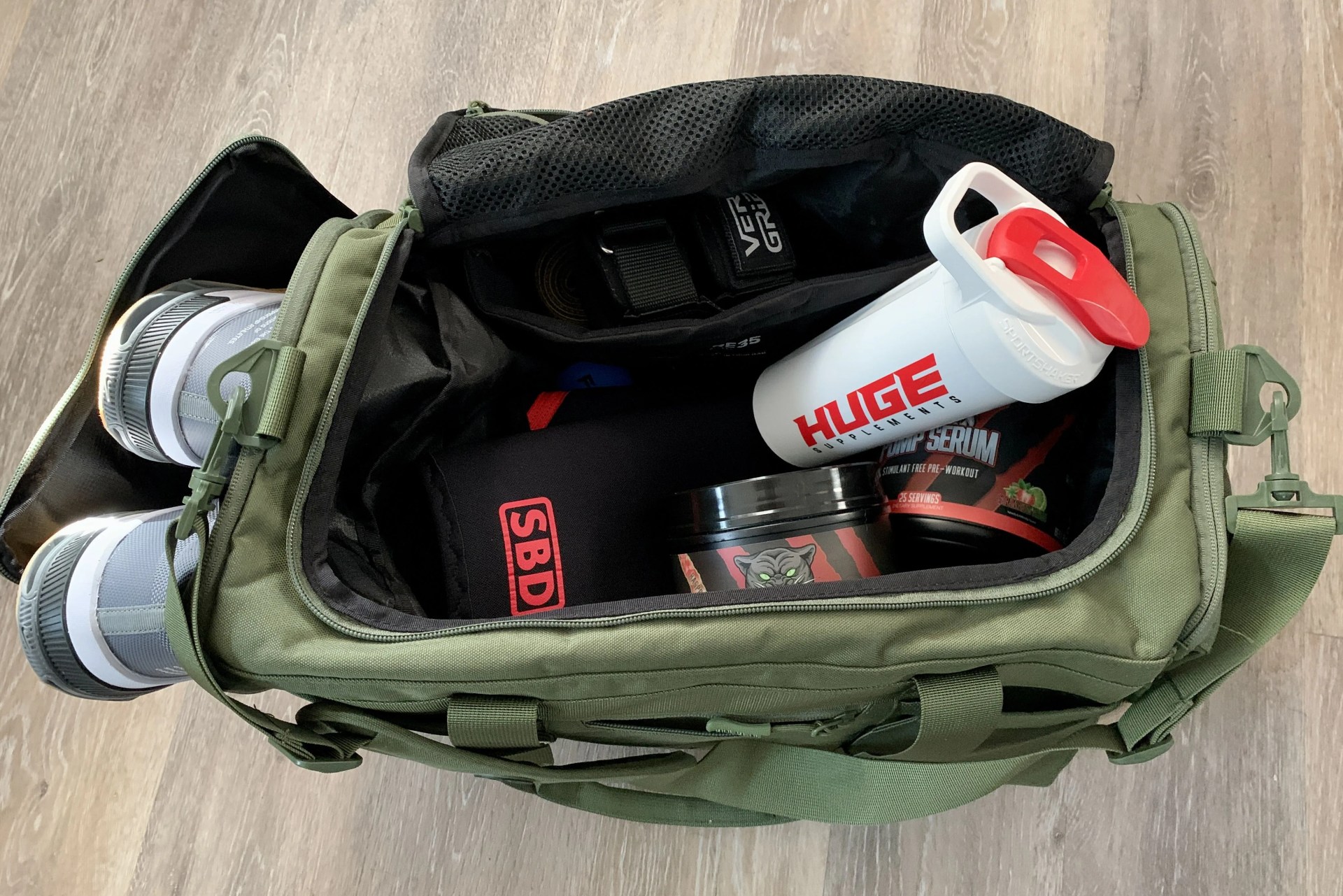 king kong core35 duffel packed with shoes and open showing gym supplies