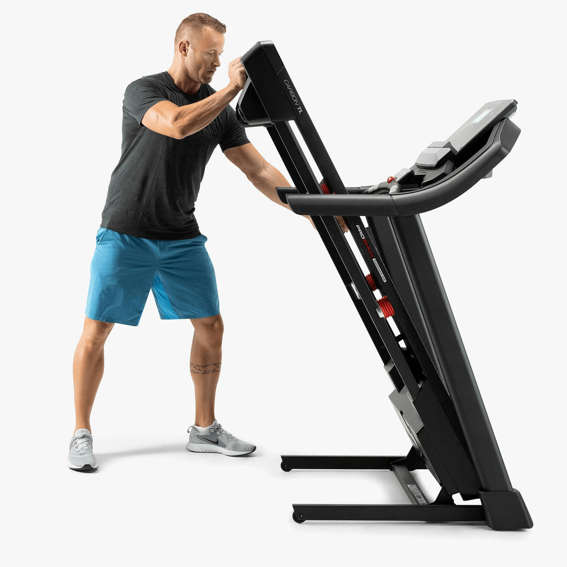 a man folding a treadmill