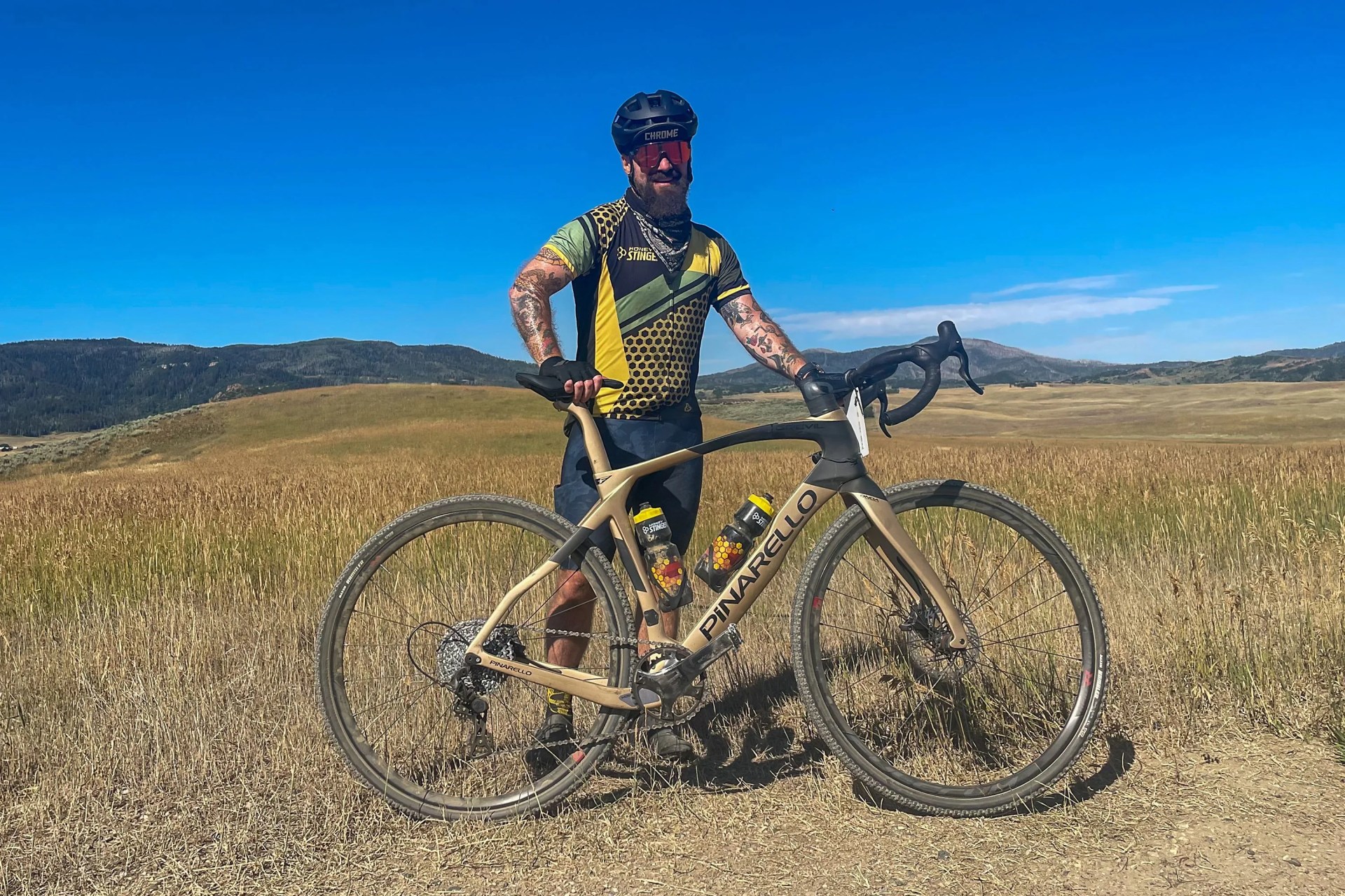 man standing with a pinarello grevil f ekar gravel bike
