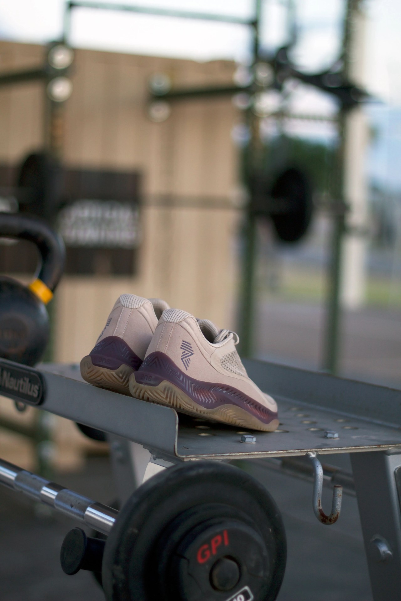the back of a pair of rad one shoes sitting on gym equipment