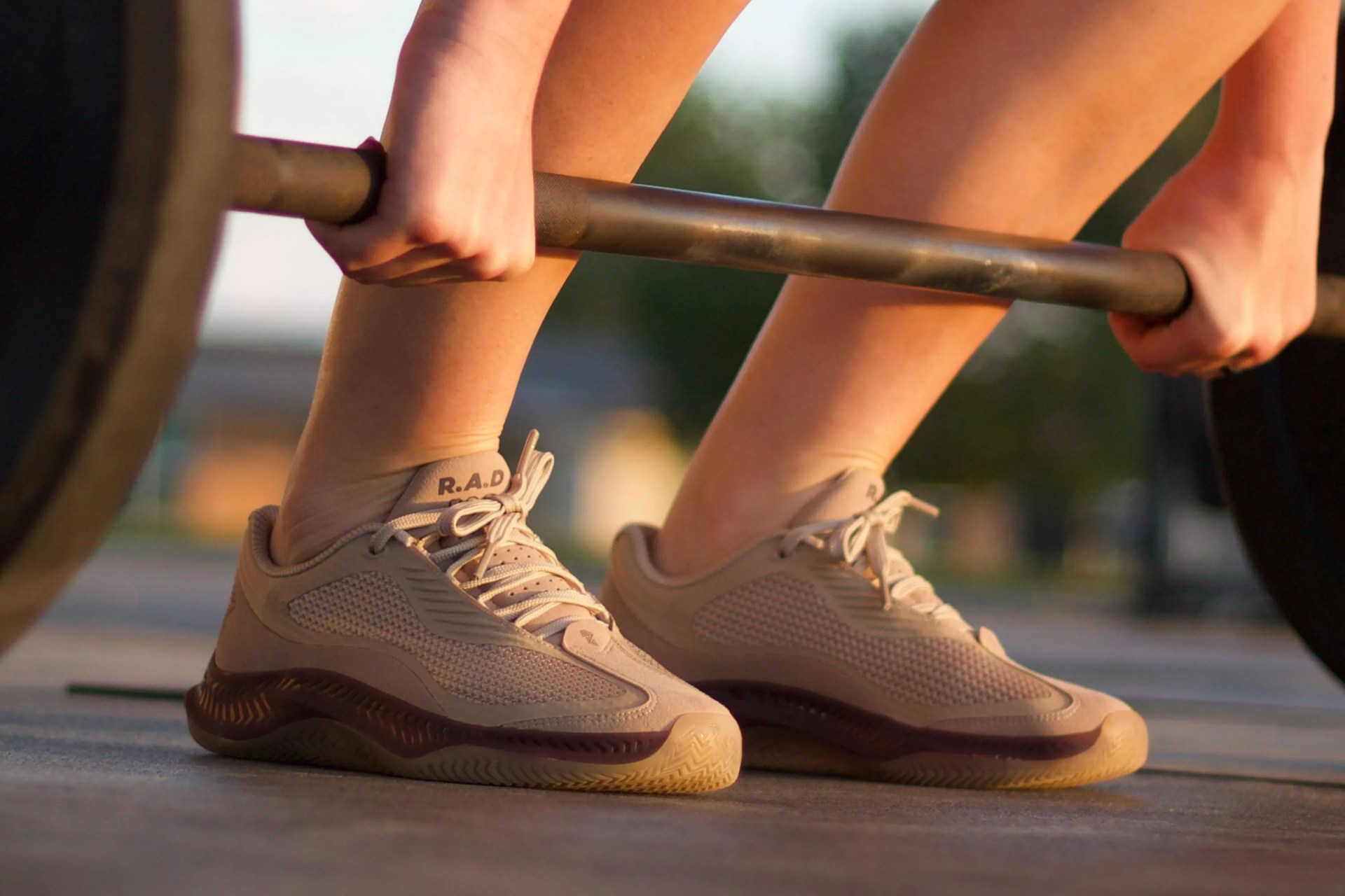 person weightlifting wearing rad one shoes