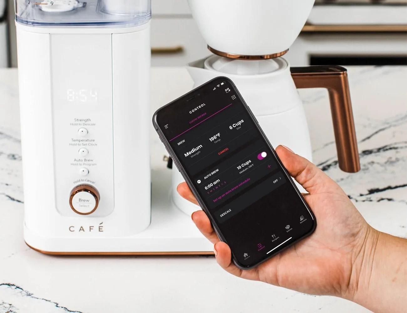 café specialty drip coffee maker connecting to phone app to control brew settings