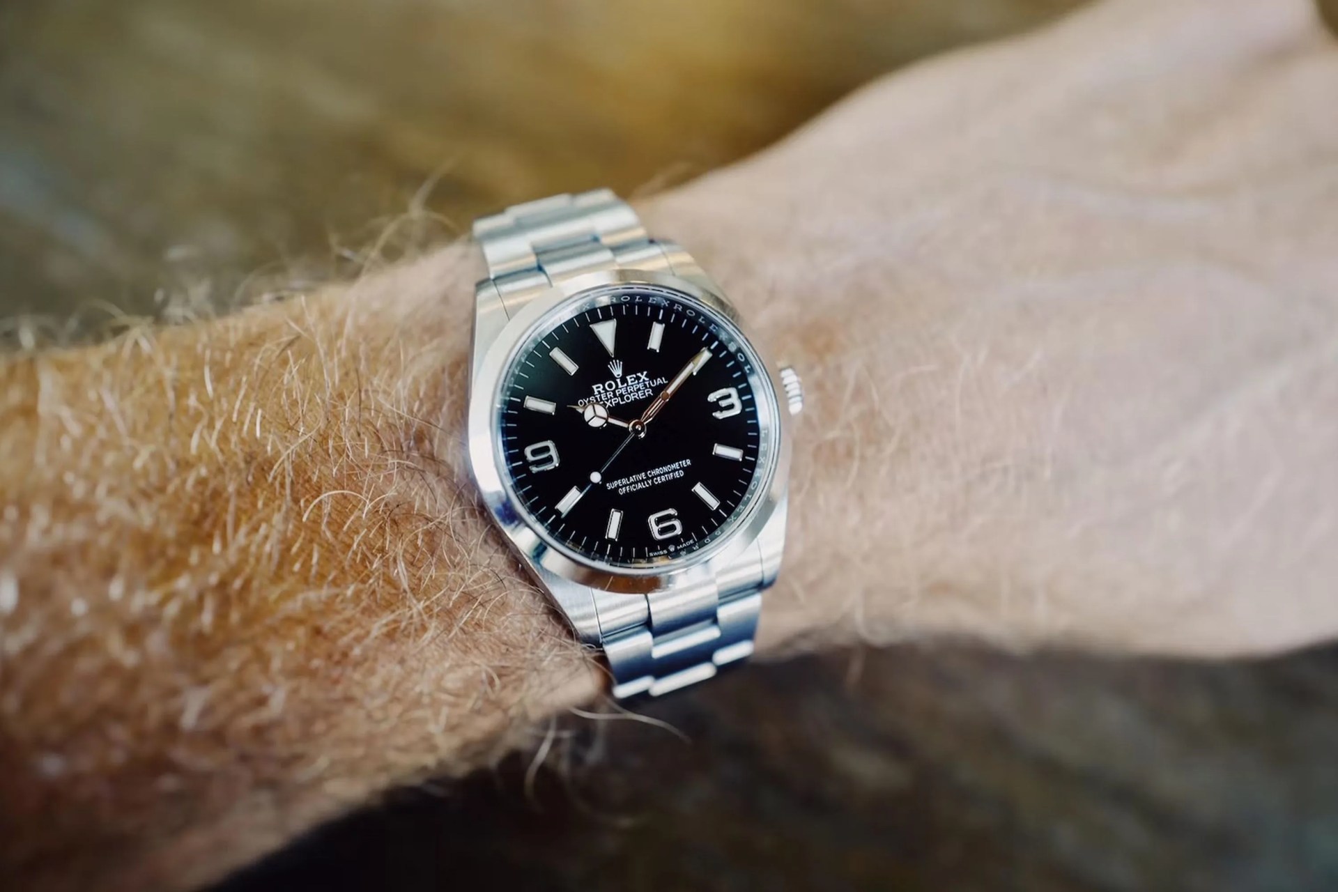 a man wearing a rolex explorer 36 watch