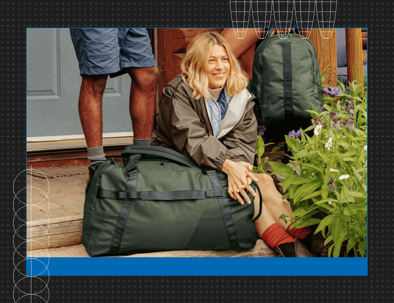 woman sitting next to a away duffle bag