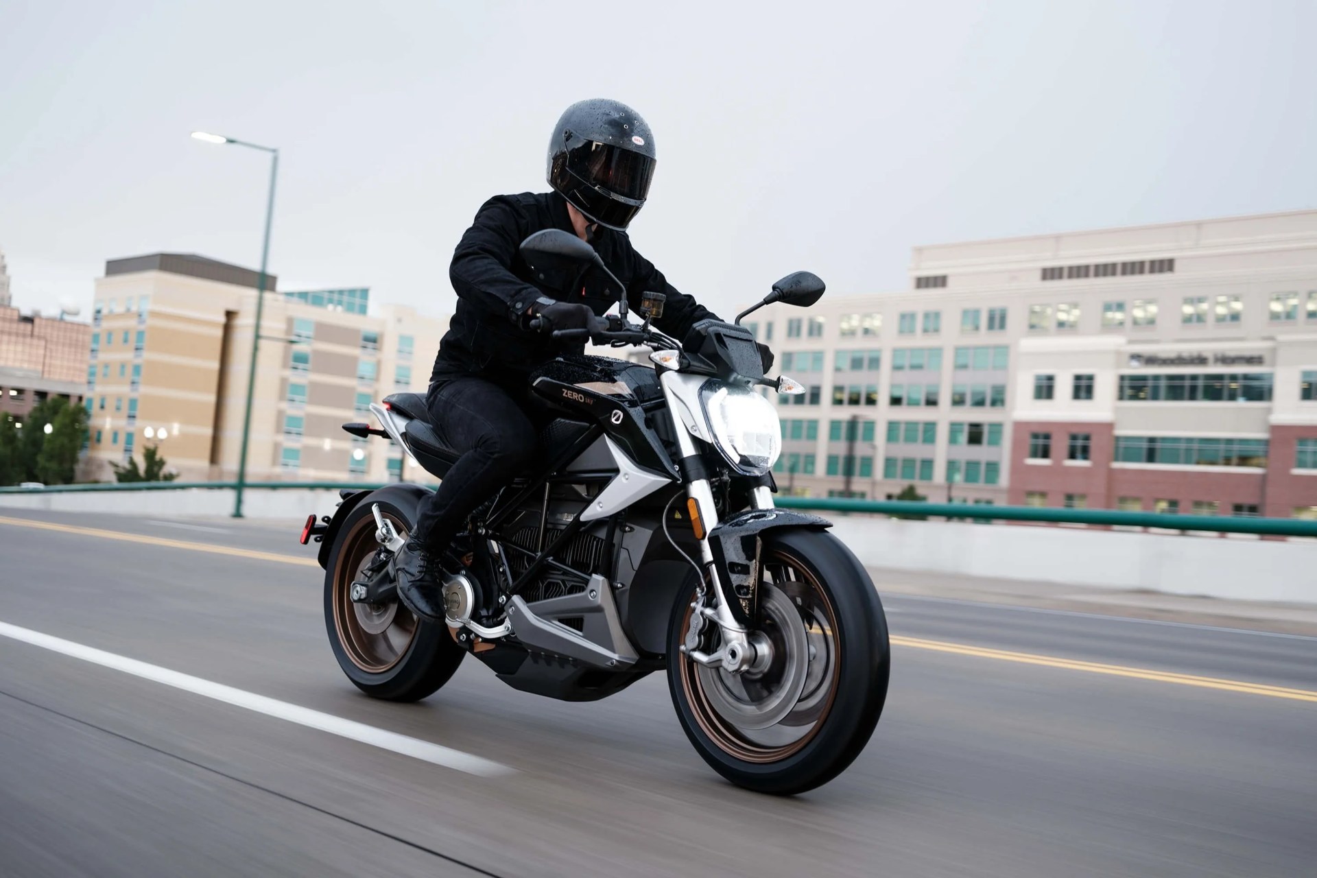 a person riding a zero motorcycle on a highway