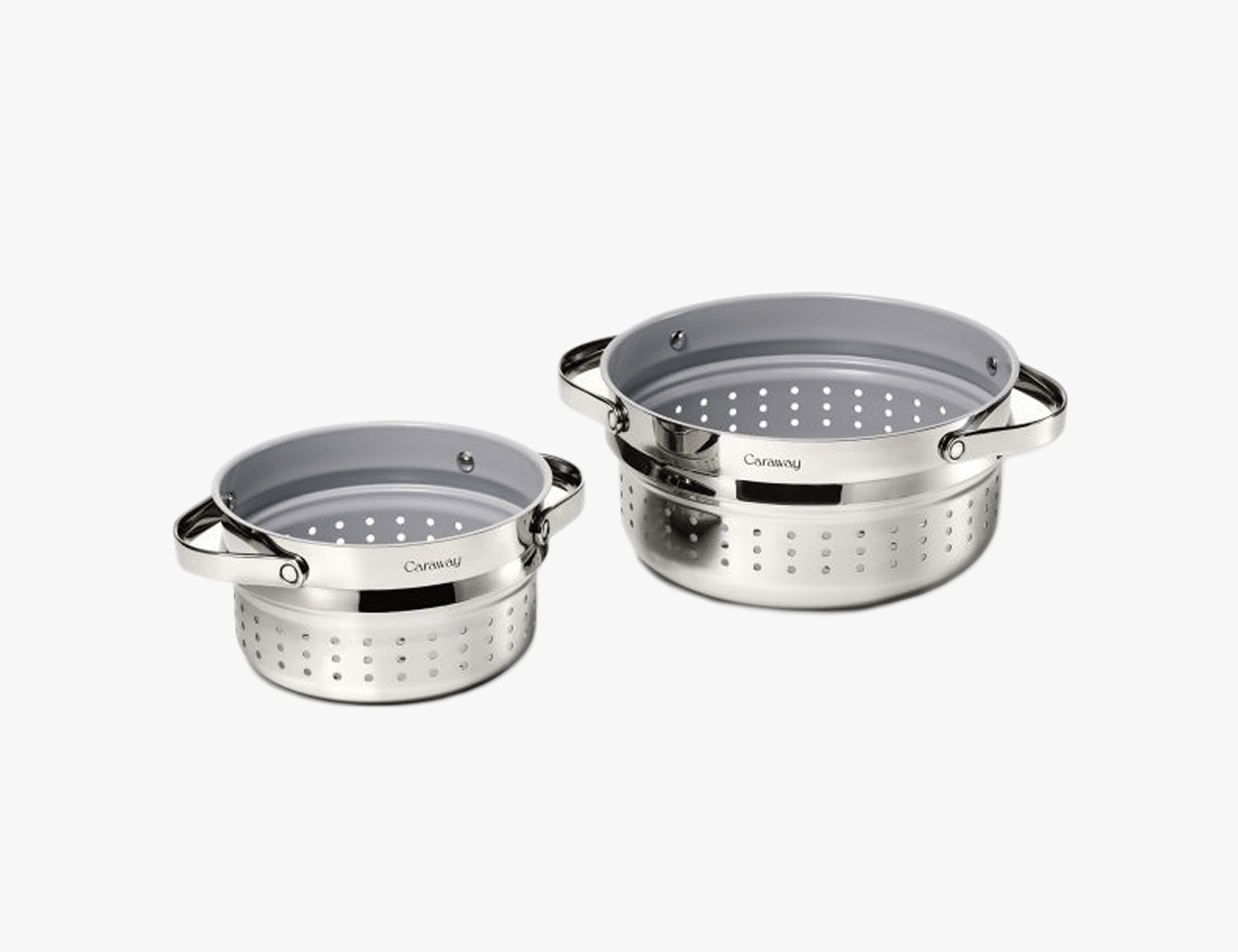 2 silver steamer pots on a white background