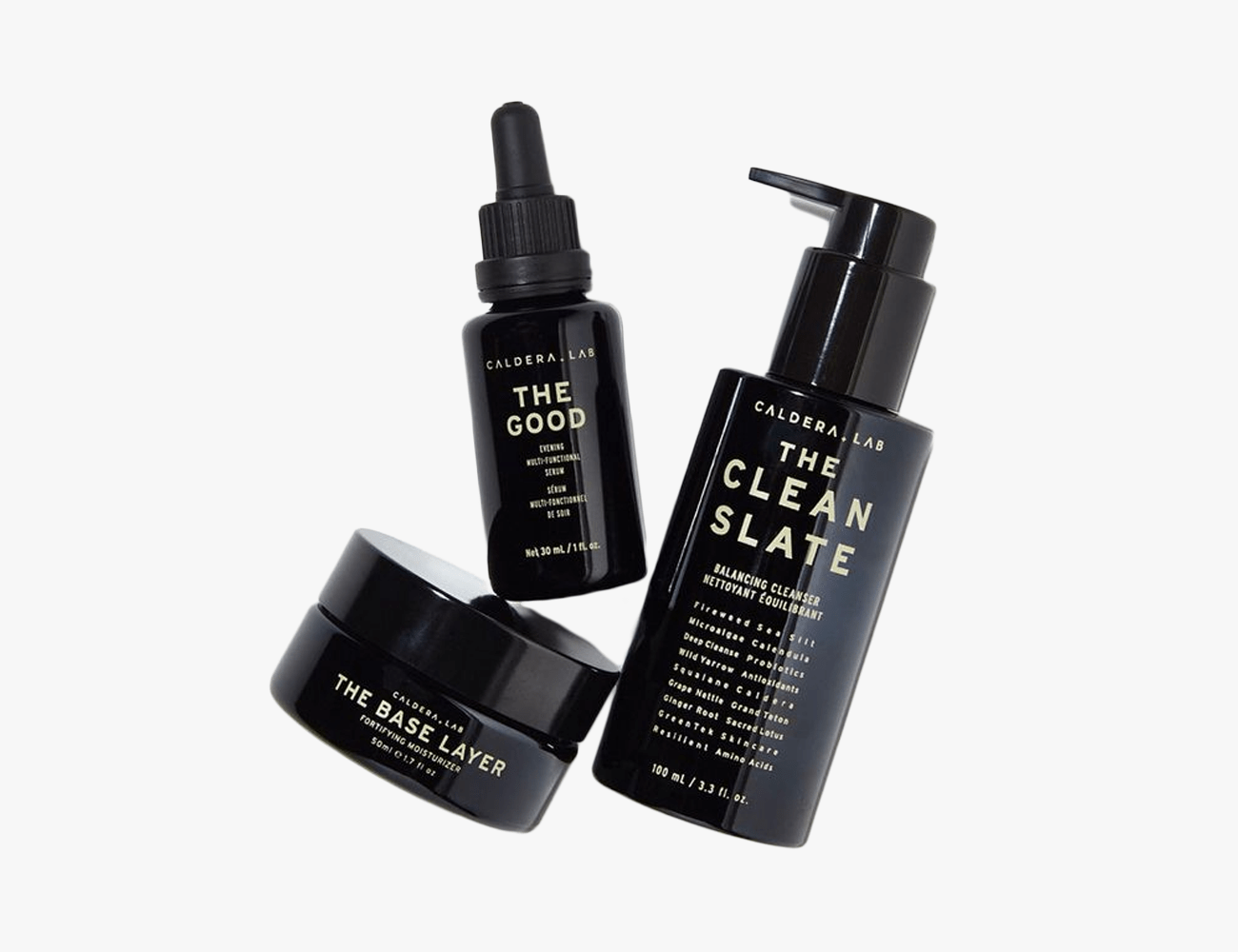 3 black skincare bottles on a white background