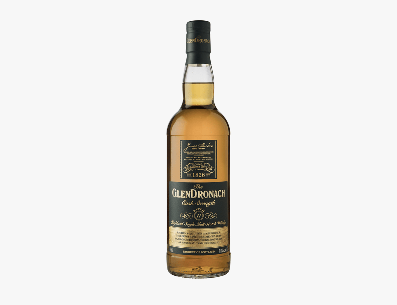a glass bottle with brown liquor and black and gold label