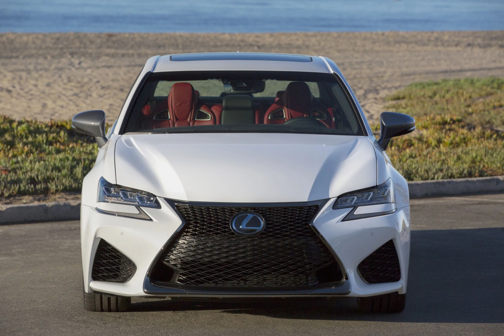 lexus gs from the front in a beach parking lot