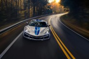 corvette e ray driving on a two lane highway