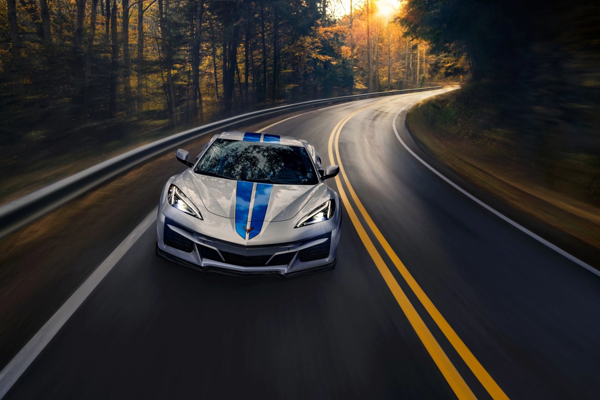 corvette e ray driving on a two lane highway