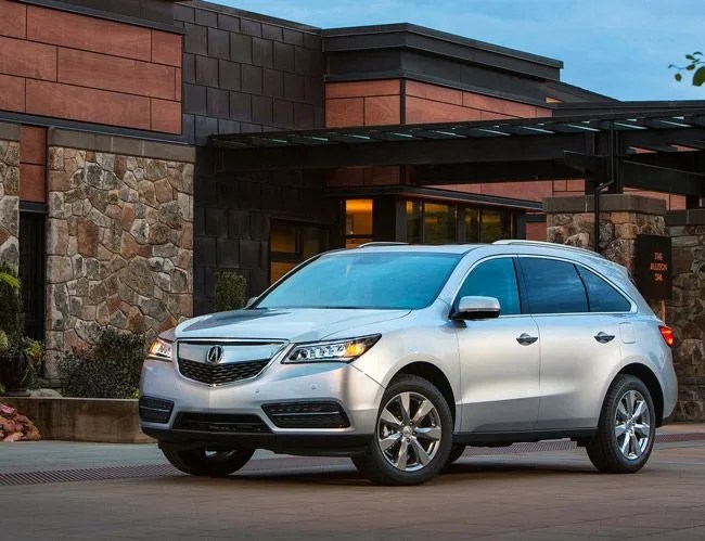 acura mdx parked in front of a modern house