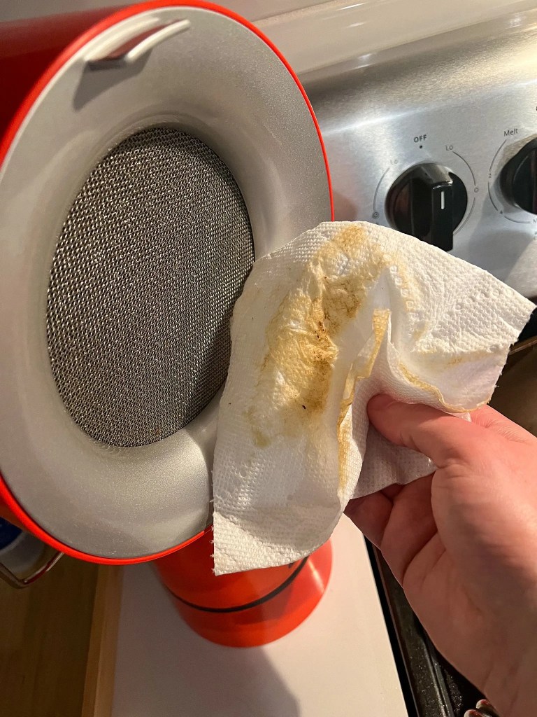 airhood vent being wiped down