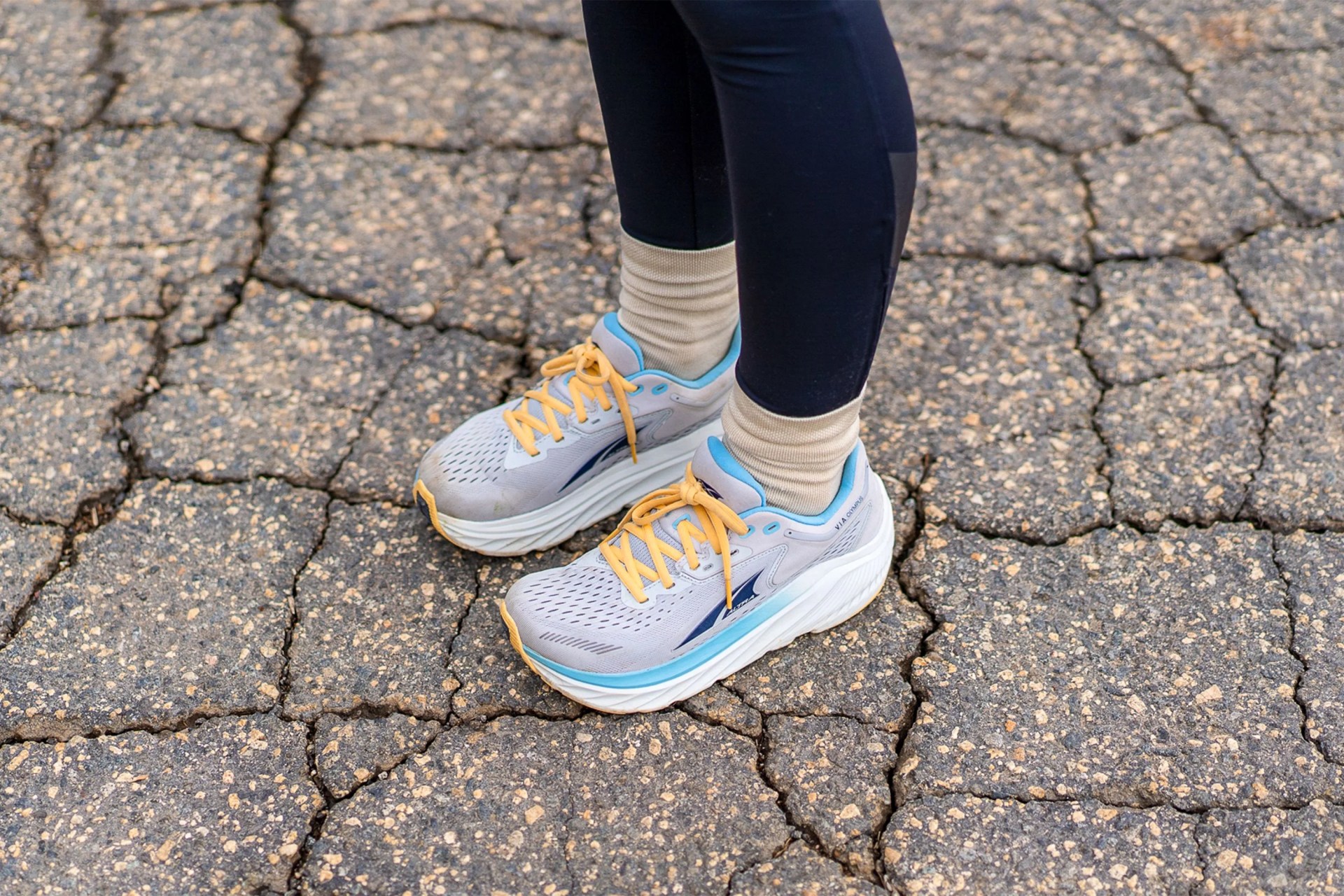 a woman wearing altra via olympus shoes