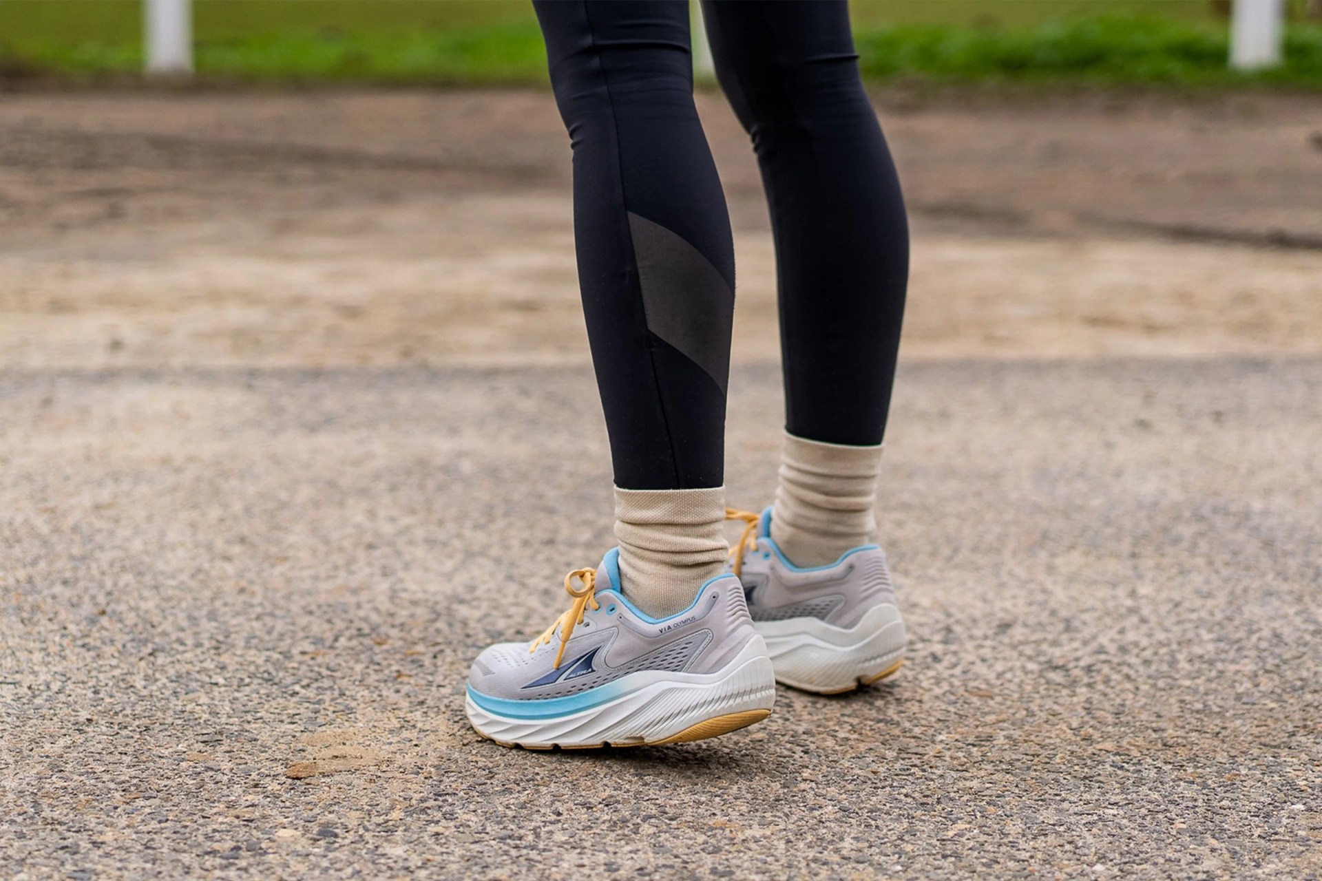 a woman wearing altra via olympus shoes