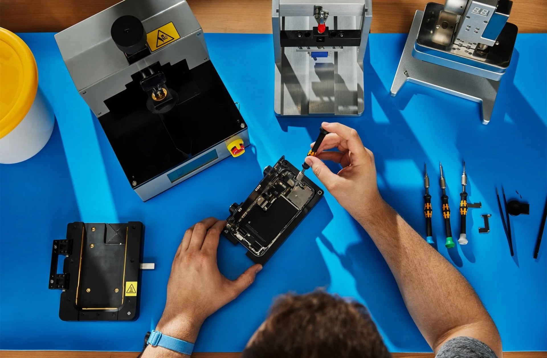 a man replacing the battery in an iphone