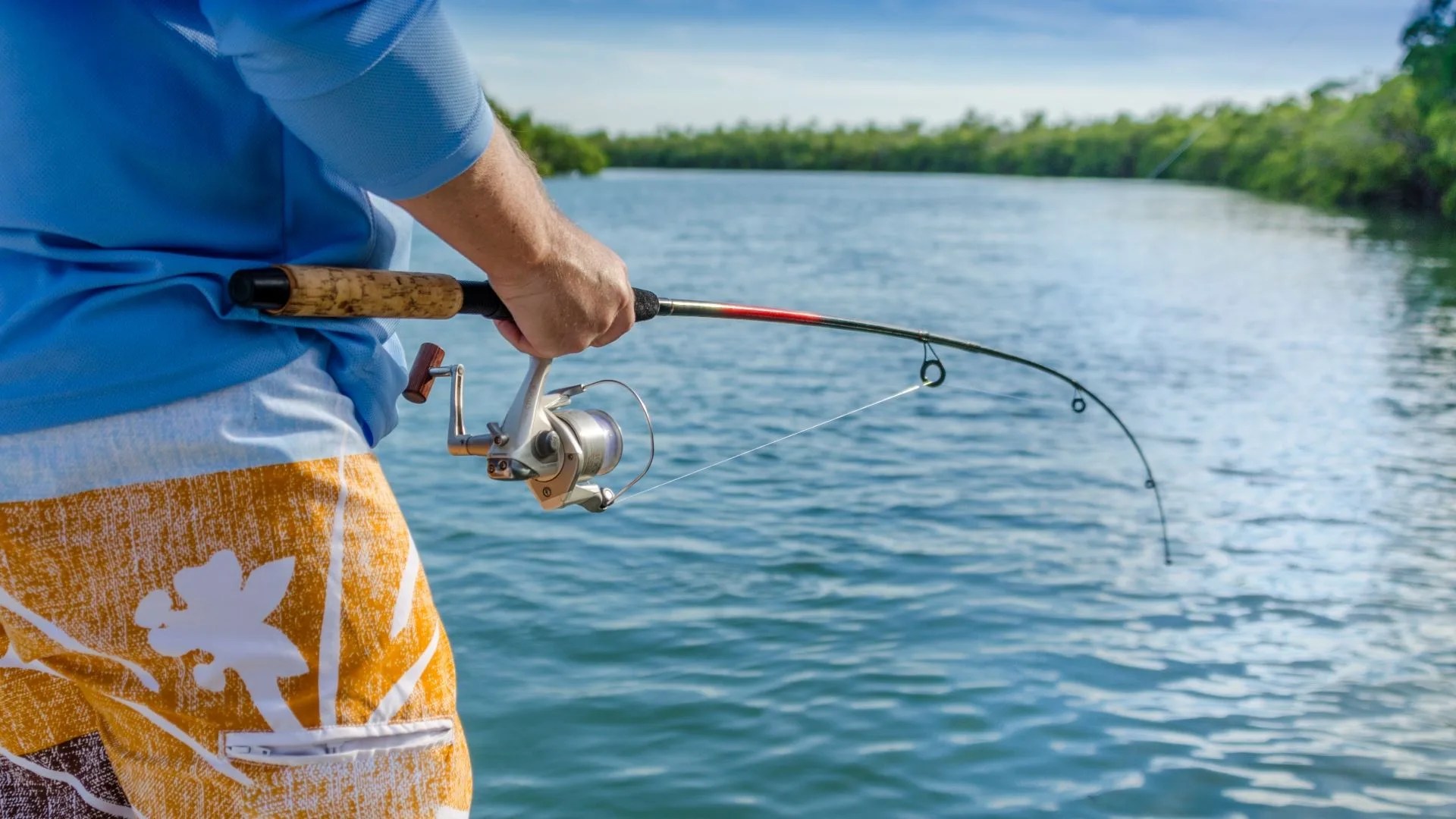 visit florida man angler fishing at isla beach