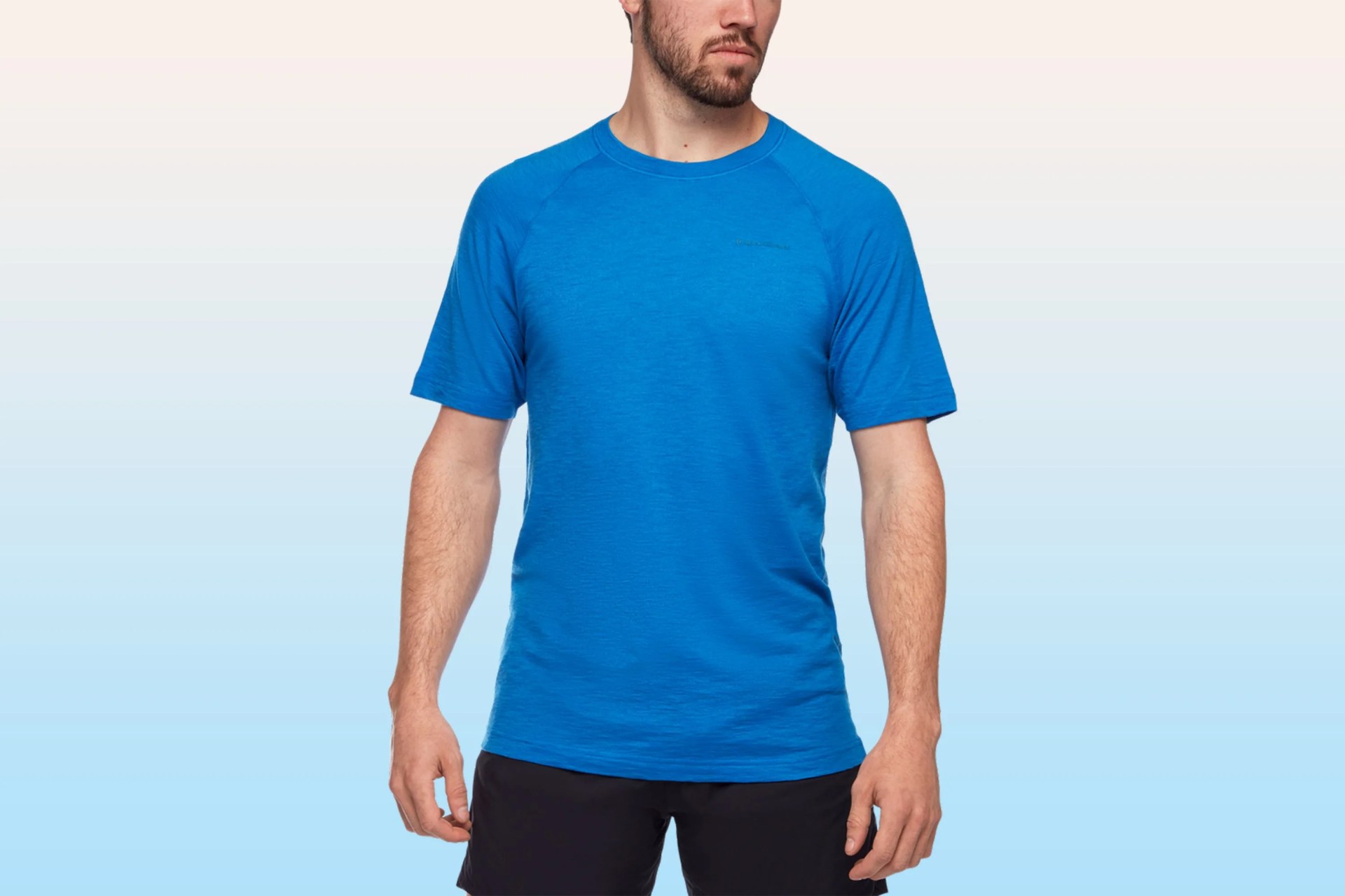 man wearing a blue black diamond rhythm tee