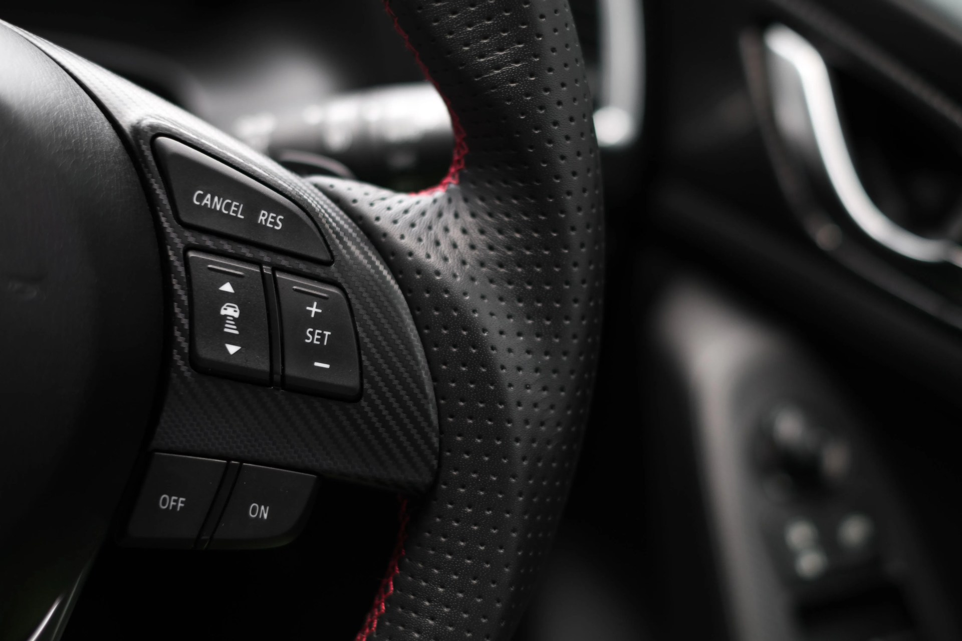 control buttons on steering wheel in a modern car