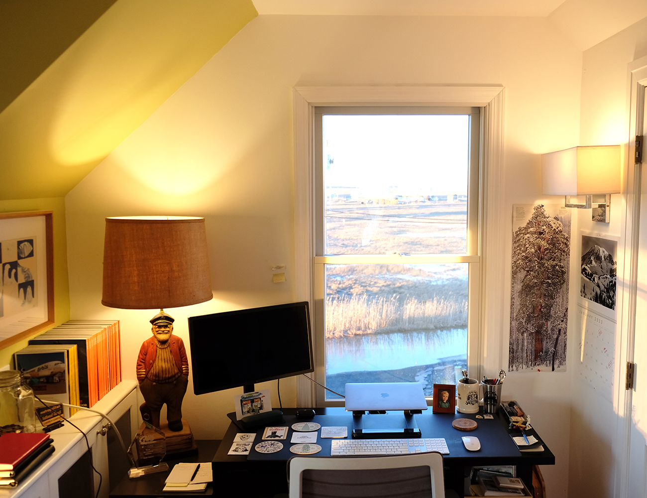 a photo of an at home office with a black desk
