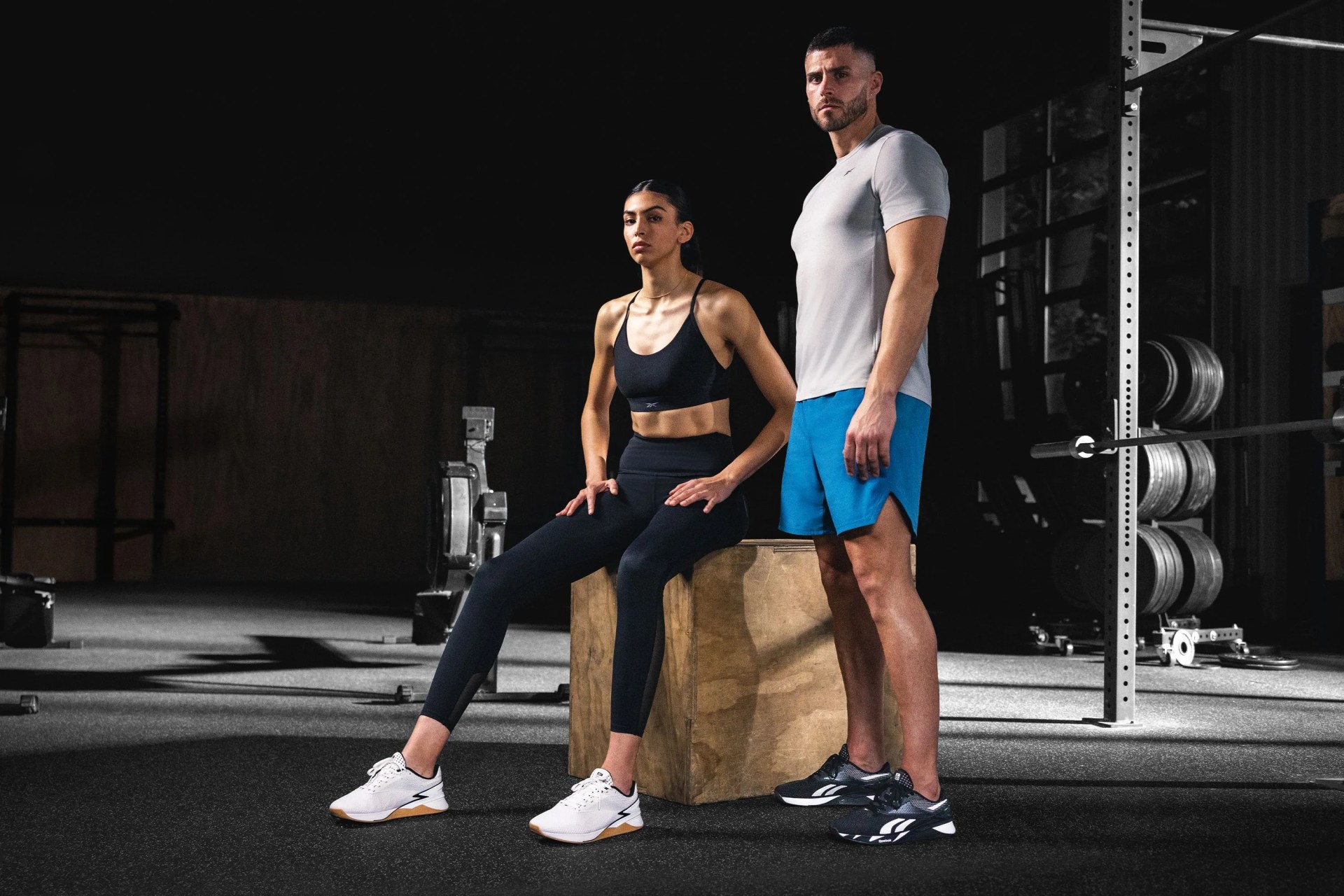 a man and woman in a gym wearing nano x3 shoes