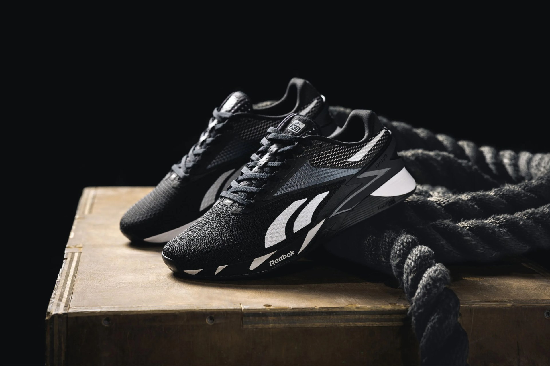 reebok nano x3 shoes on a wooden box with rope