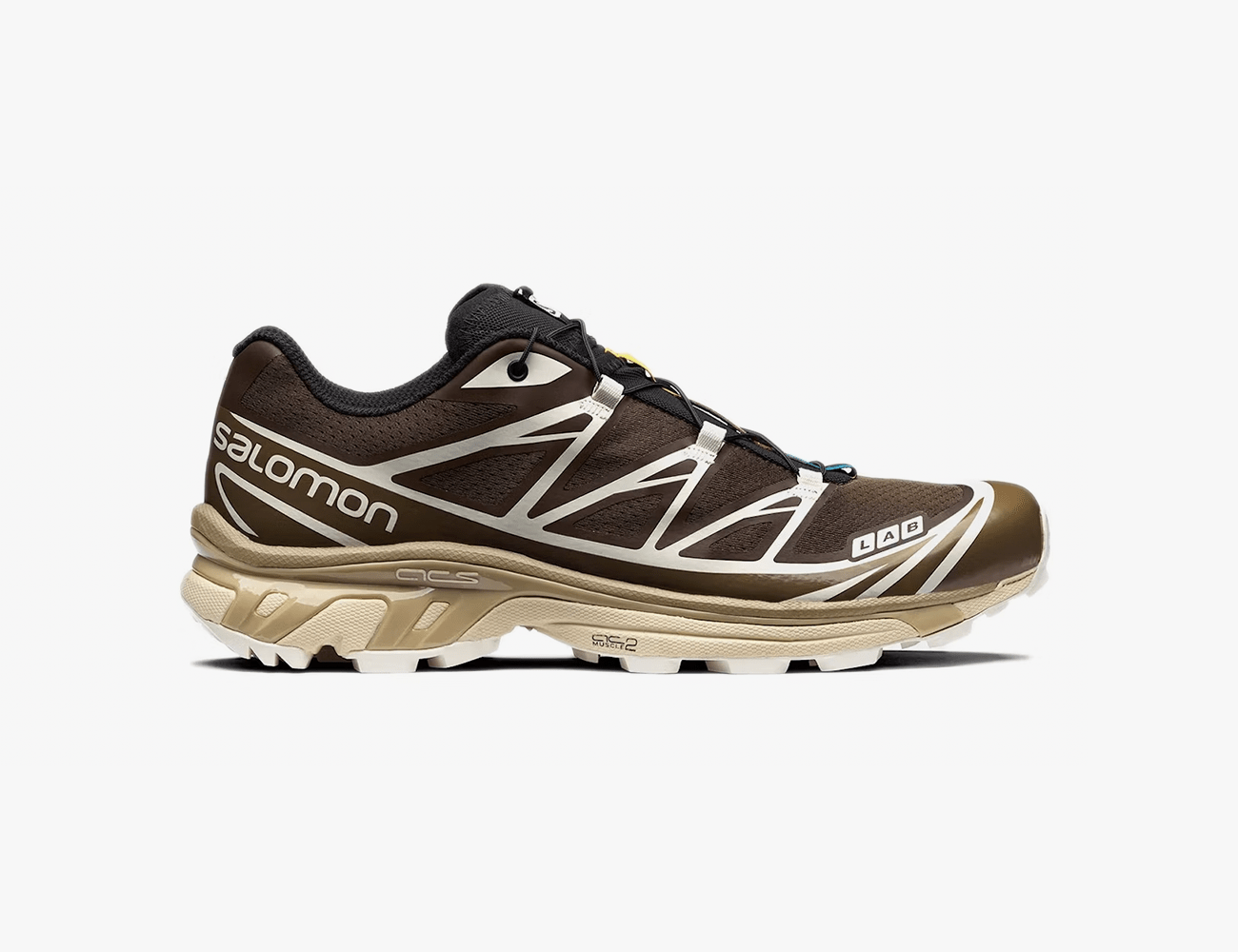 brown and gold shoes with white accents