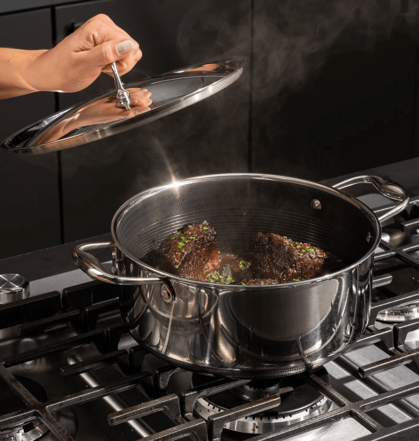 dutch oven on stove with meat in it