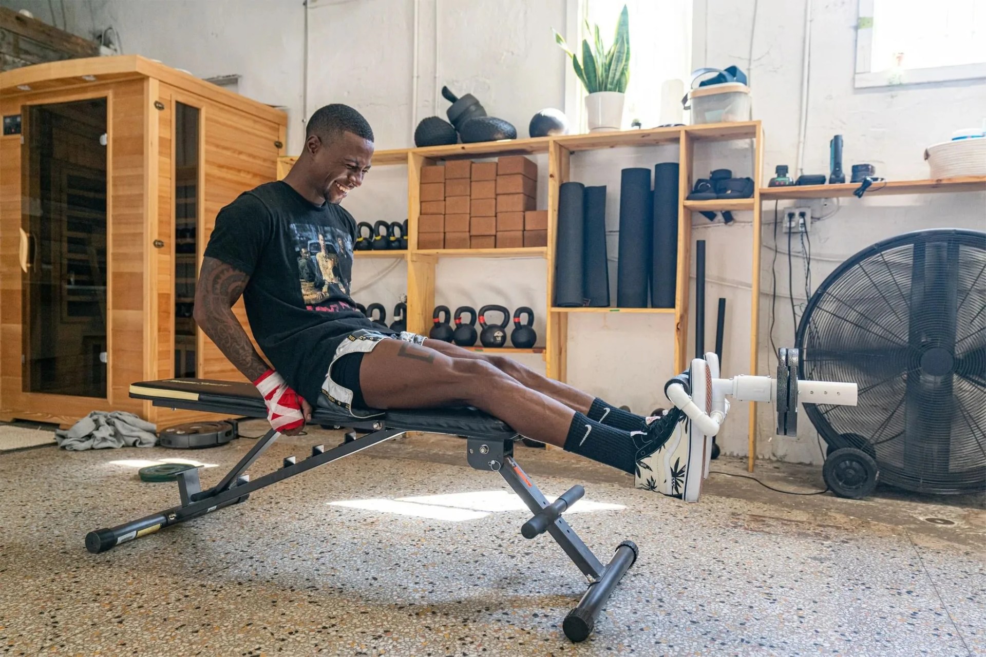a man on a bench using a tib bar