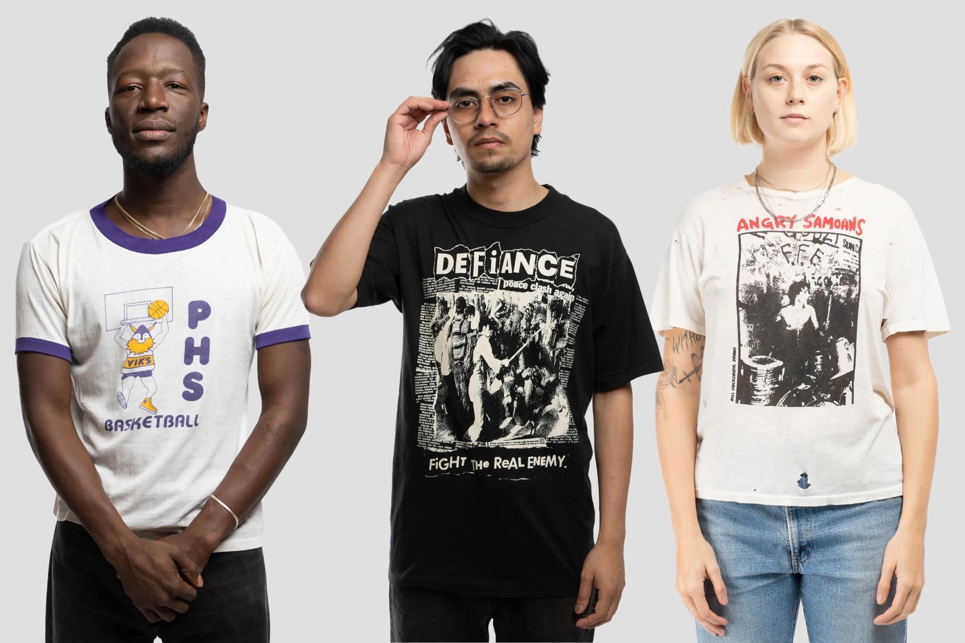 three people wearing vintage tshirts