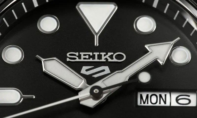 close up of watch hands on a seiko watch face